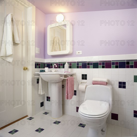 Contemporary bath in lavender and white with pedestal sink