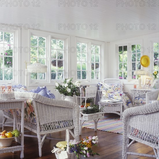 White wicker with floral cushions