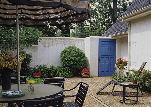 Courtyard area with high stucco walls