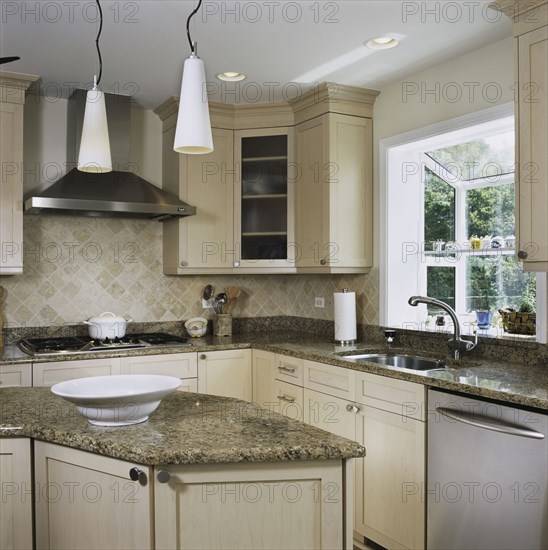 Granite counters in kitchen with triangle work area