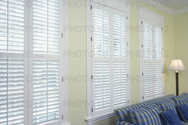 Bank of windows along wall in family room.