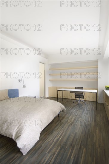 Modern bedroom with hardwood floors