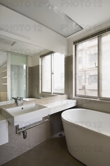 Modern bathroom near window