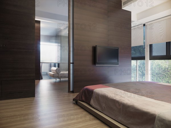 Simple modern bedroom with flat screen television