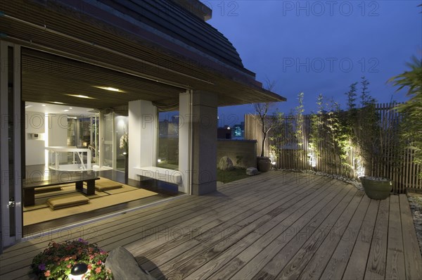 Oriental dining room open to outdoor deck