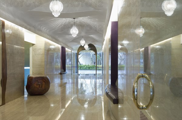 View down long modern marble hallway