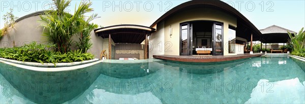 Panoramic view of private pool outside of resort suite