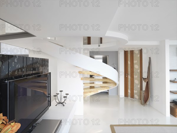 Modern winding staircase and television