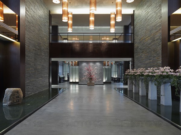 Large hallway with cherry blossom plants