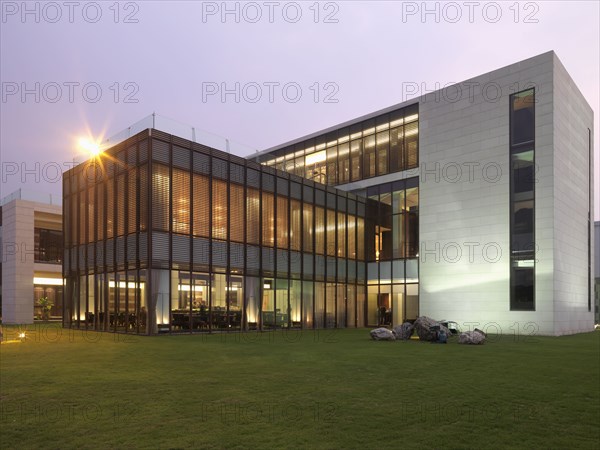 Exterior view modern building with all glass dining room