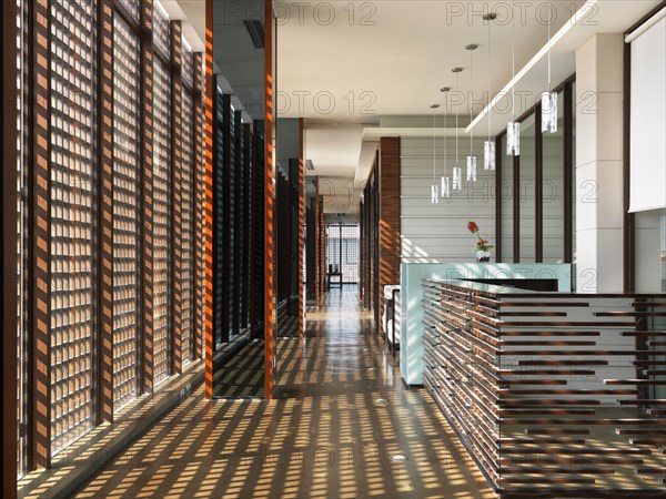 Hallway with grid shadows from windows