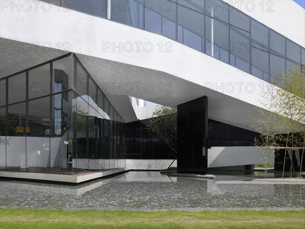 Reflecting pool outside of modern white building