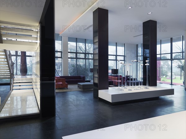 Large modern interior with marble staircase and sitting area