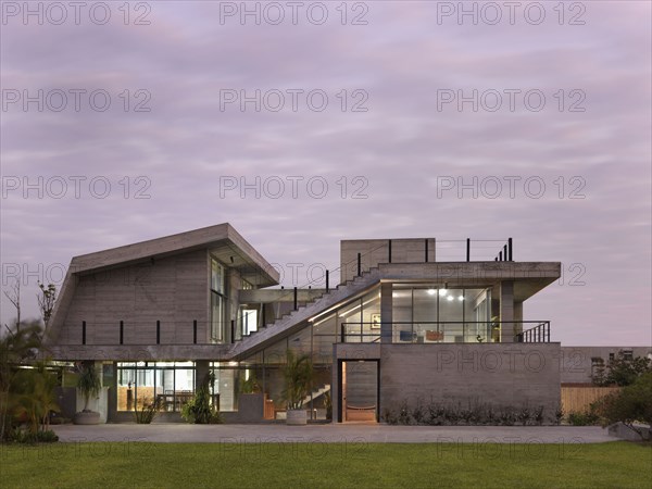 Front exterior modern home at sunset