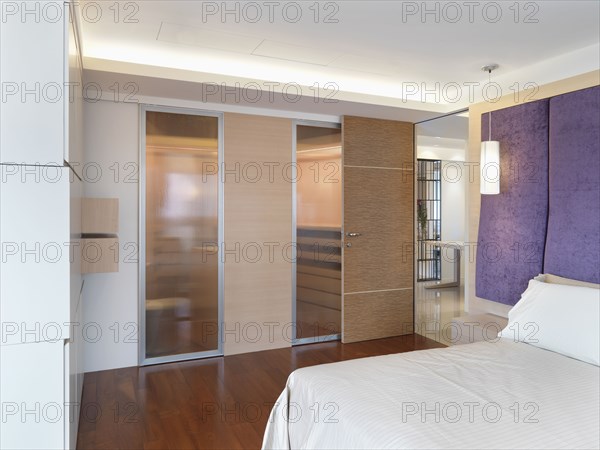 Bedroom with hardwood floors in modern home