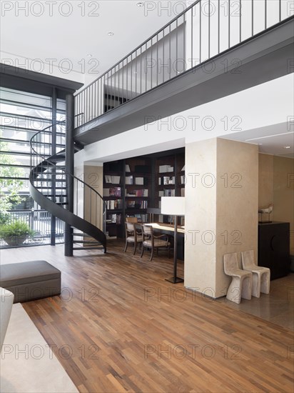 Modern interior with spiral staircase and hardwood floors