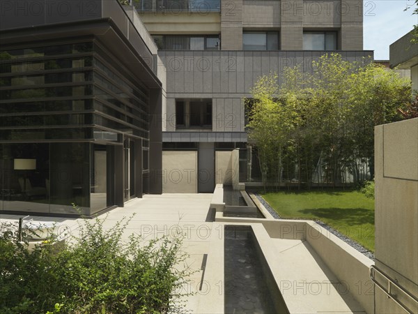 Fountains and terrace outside building