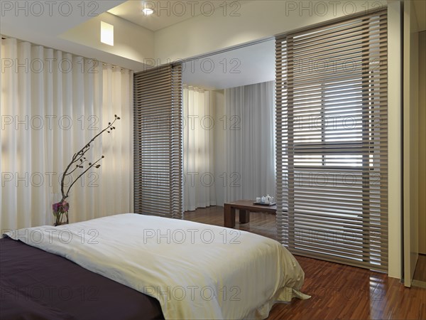 Small bedroom with sliding wooden screens