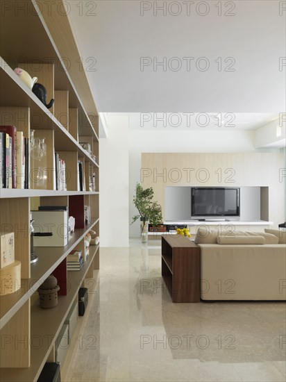 View down bookcase to simple living room