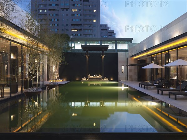 Modern swimming pool at dusk