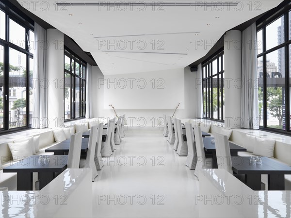 Long narrow white modern dining room