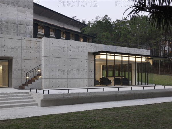 Modern cement patio and hardwood staircase