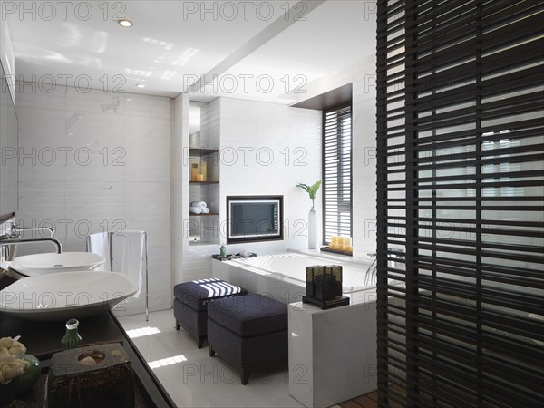 Modern white bathroom with double bowl sinks