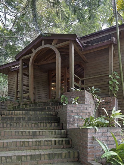 Brick steps to entrance of timber construction building