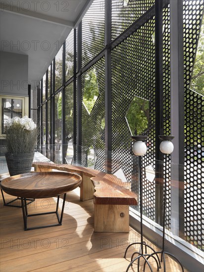 Wooden bench and coffee table by window