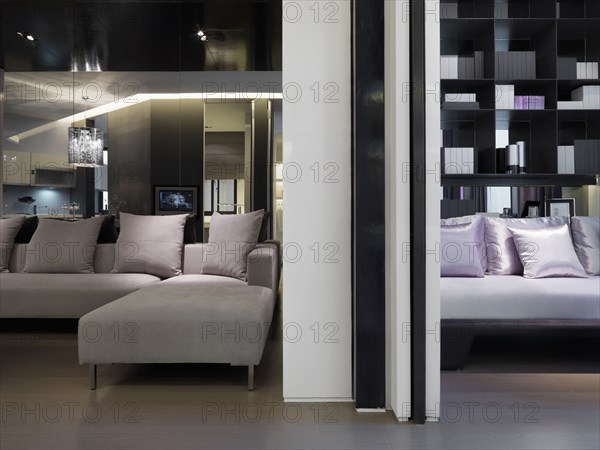 Modern sectional sofa in front of mirror