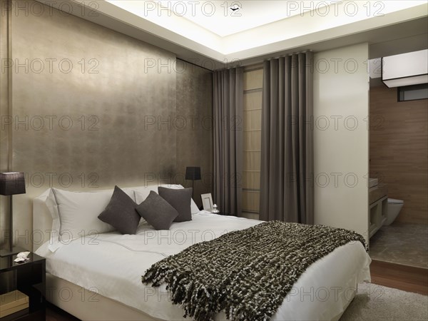 Modern bedroom with gold wall