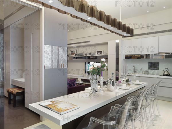 Modern breakfast bar with clear plastic chairs