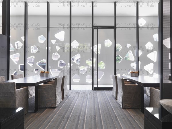 Floor to ceiling windows in modern dining room