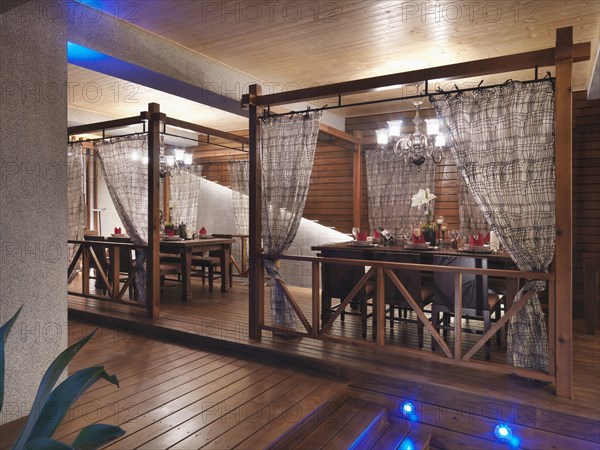 Dining table with chandeliers set up on back deck