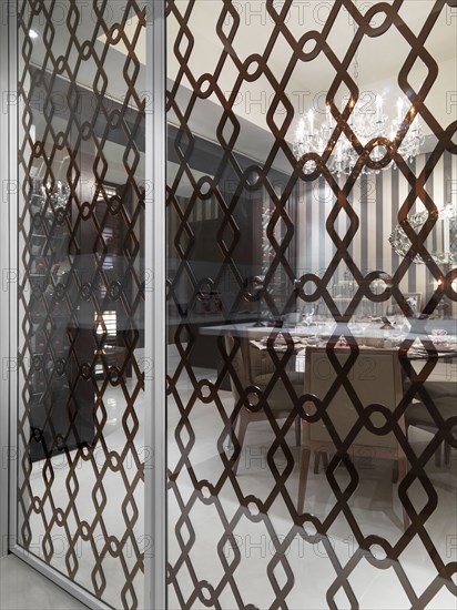 Glass partition outside elegant dining room