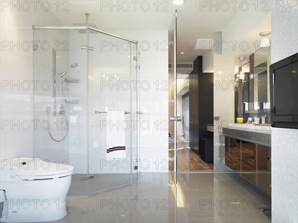 Clean modern bathroom with large glass shower