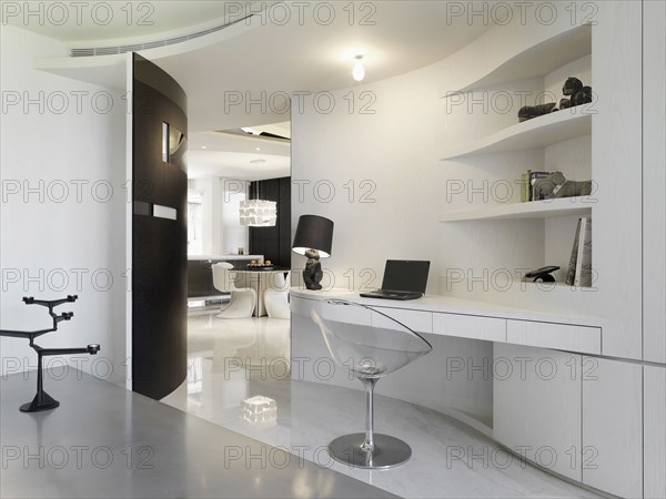 Modern style desk with bunny lamp and clear chair