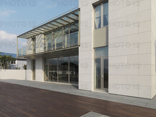 Patio out back of modern multiple story home