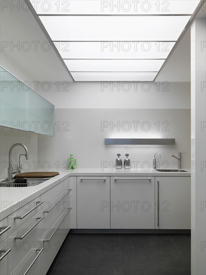 Modern white kitchen in minimalistic home