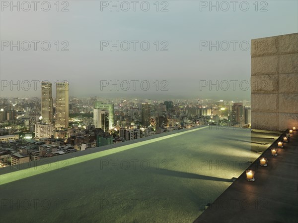 Patio and reflection pool overlooking city