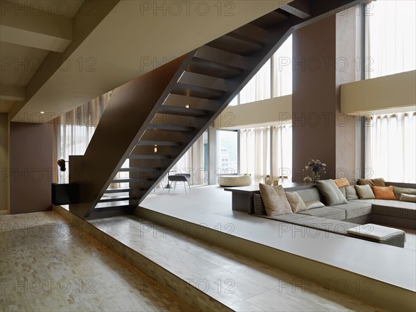 Built in sofa and staircase in modern home