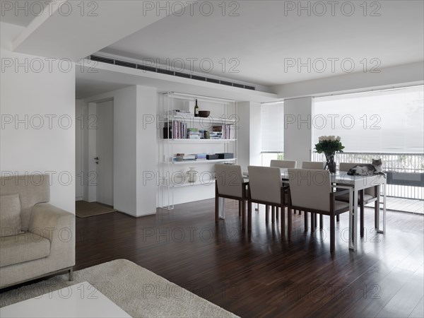 Dining room table in front of large windows