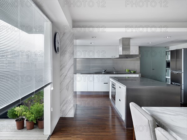 Modern Kitchen and dining room with stainless steel kitchen island