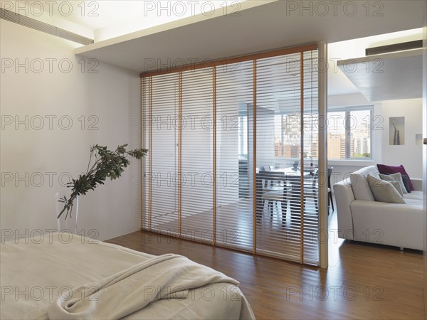 Partition separating bedroom from living room