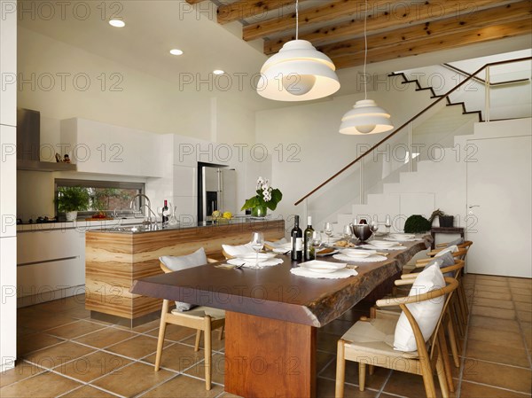 Large wooden dining table in kitchen