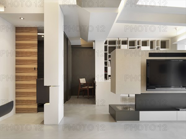 Entertainment center in light colored modern interior