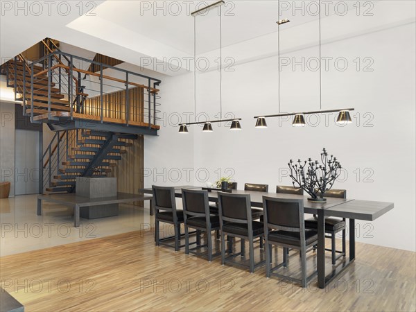 Dining room table and staircase in modern home