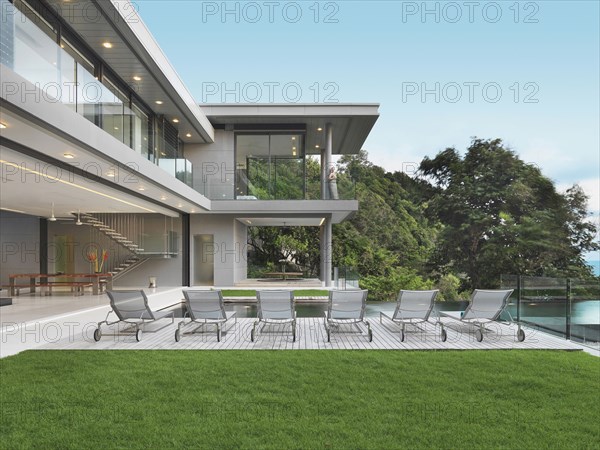 Lounge chairs along poolside