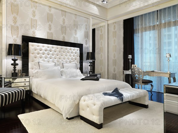 White bed in elegant master bedroom