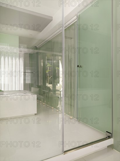 Glass wall around modern bathroom